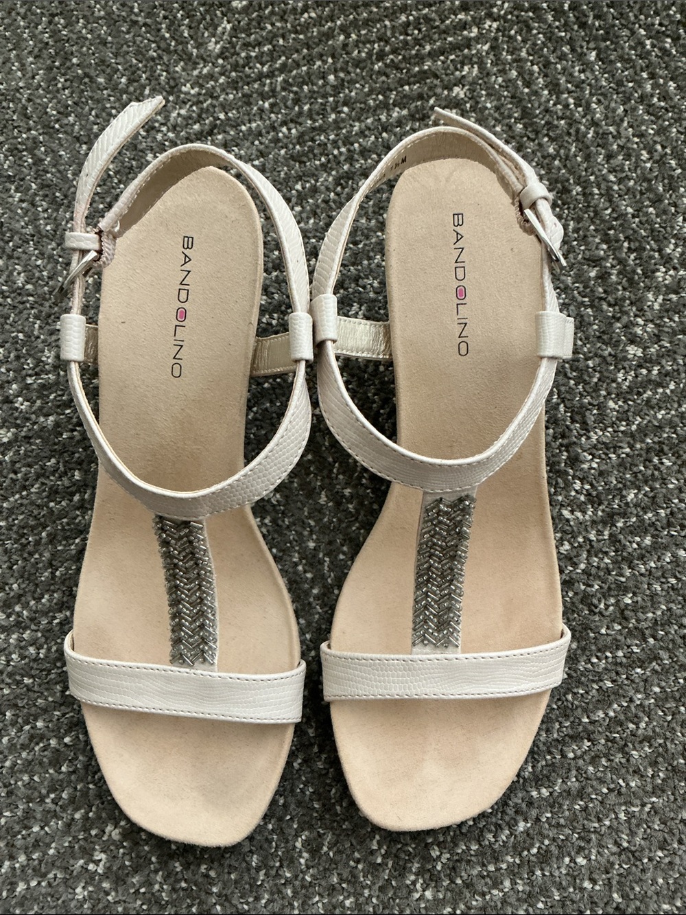 Bandolino Cream T‑Strap Sandals with Silver Braided Accent